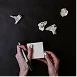 Hands working on a device or document, representing professional results delivered to clients.